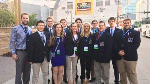Alexandria Area High School DECA students stand outside the Bridgestone Arena before the grand opening session of the International DECA Conference in Tennessee. They include (back row, left to right) adviser Eric Hartmann, Jack Anderson, Nick Dee, Justin Schmitz, Brady Kisthart, Taylor Blank, (front) Peter Rohr, Paige Revering, Elise Anderson, Morgan Melrose, Josh Brezina and Dylan Larson.