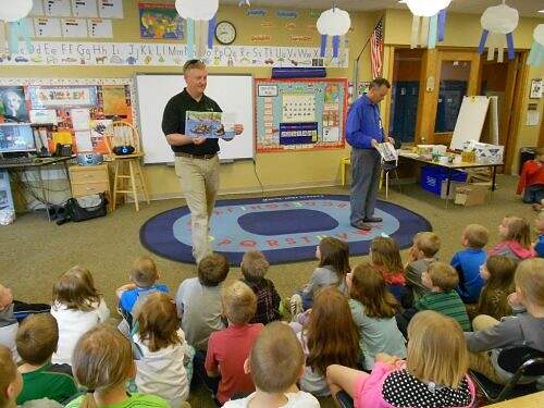 Shawn Reilly sharing a water safety book with local schools